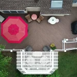 Overhead view of a multi-level composite deck with outdoor furniture